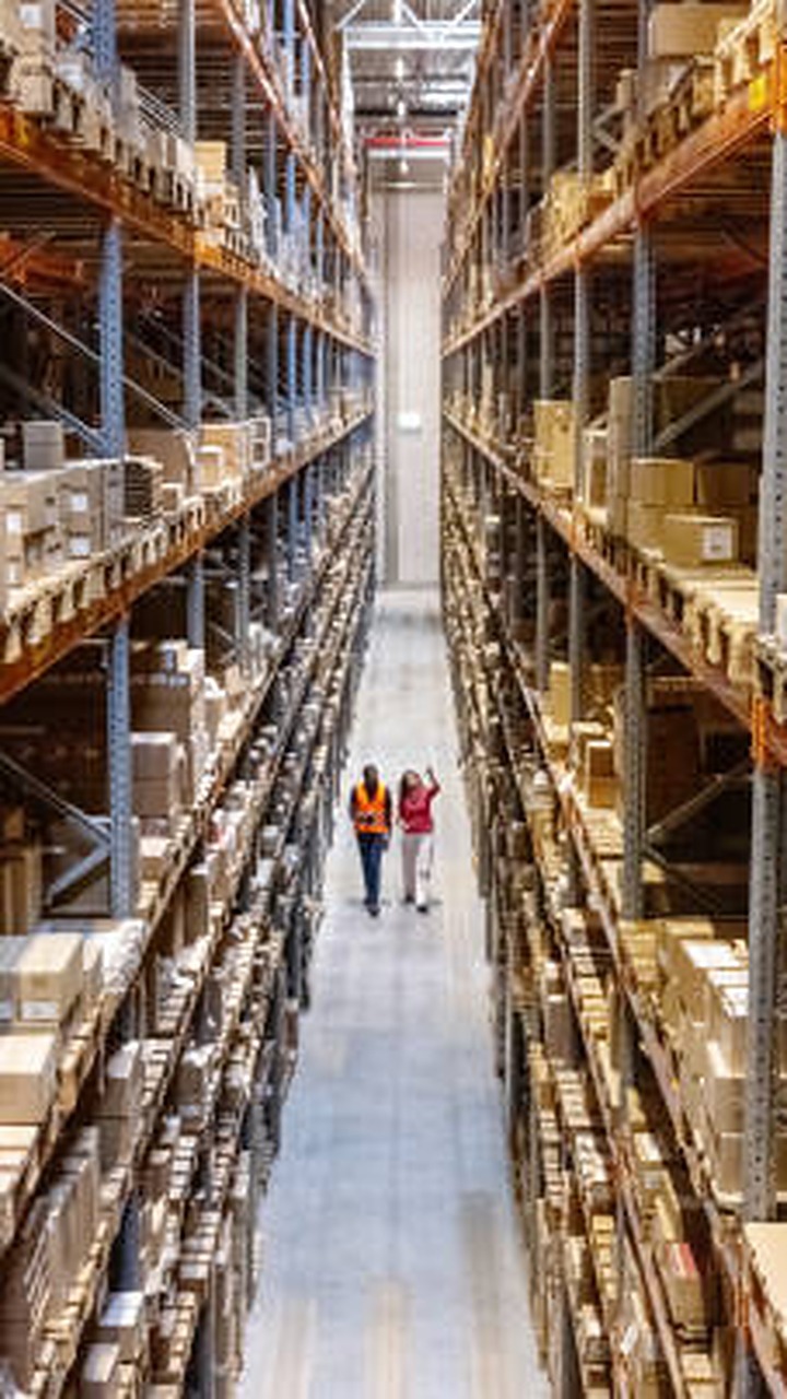 Warehouse team performing a physical inventory count with control sheets