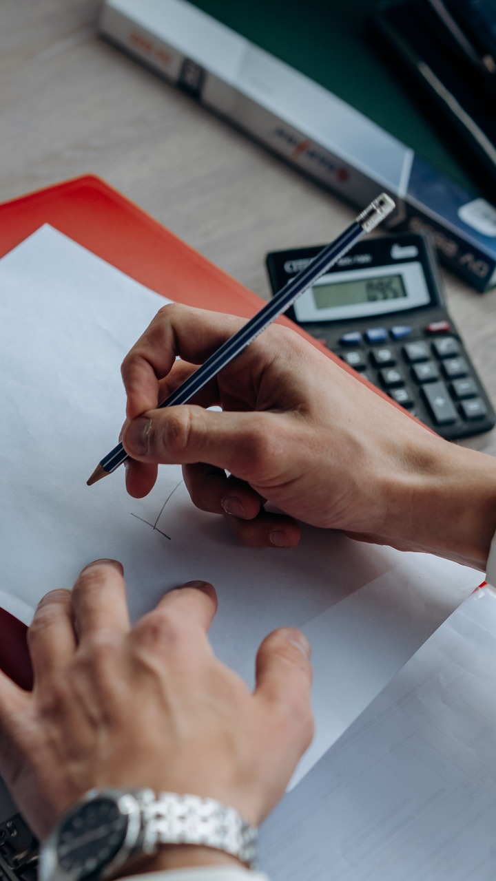 Auditor reviewing journal entries during fraud risk testing
