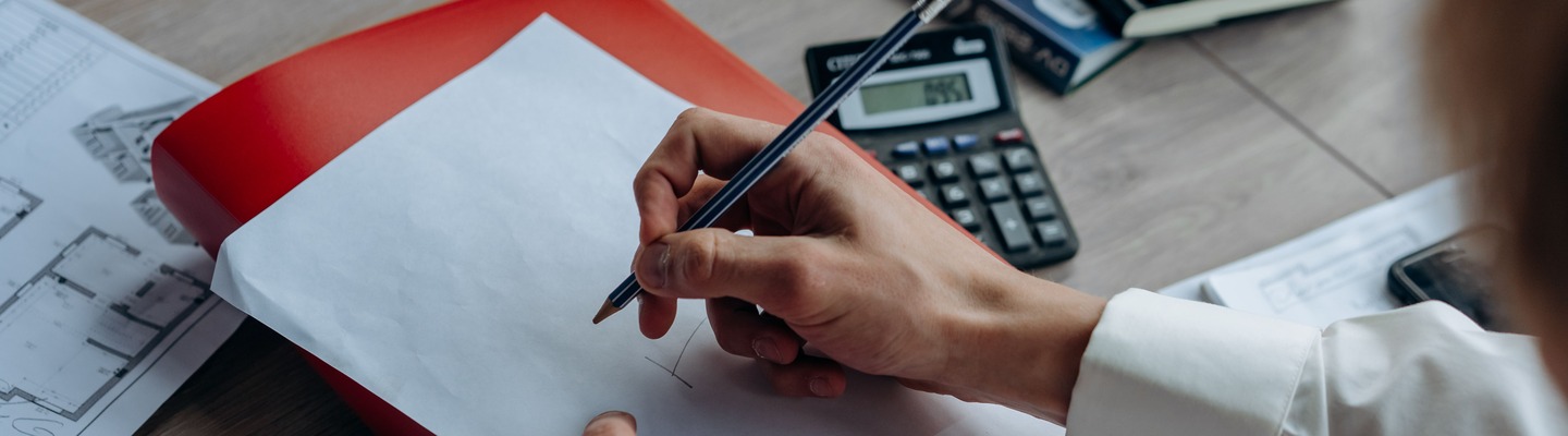 Auditor reviewing journal entries during fraud risk testing